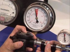 Using an intermediate pressure gauge and magnehelic to adjust a Scubapro S600