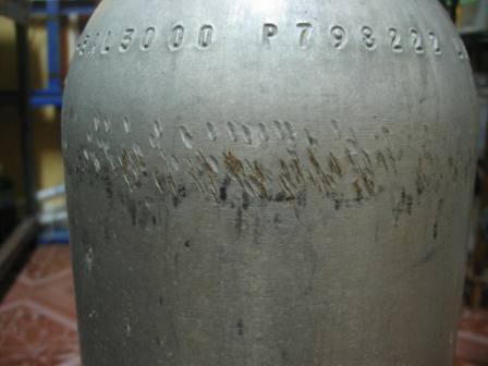 Aluminium scuba tank fell trhough an open hatch and came to rest agaist the revolving prop shaft. photo 2